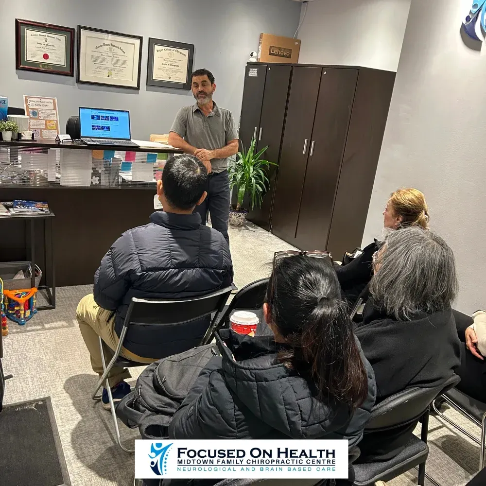 Dr. Najafian presenting at a patient health workshop — Midtown Family Chiropractic Centre